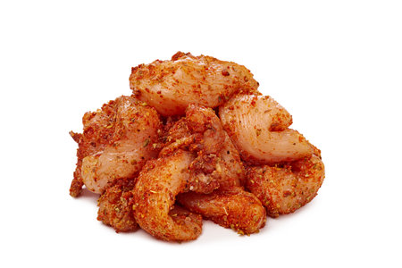 Seasoned chicken breast strips without skin ready-to-cooking on white background.の写真素材