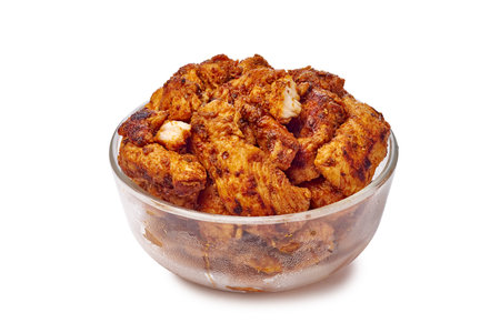 Enjoy a Delicious Spicy Chicken Snack served in a Bowl, perfect for any occasion or mealの写真素材