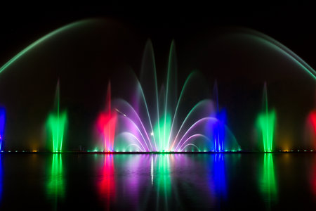 Colored water fountain at night. Beauty backgroundの写真素材