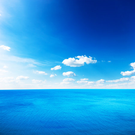 Blue sea under clouds skyの写真素材