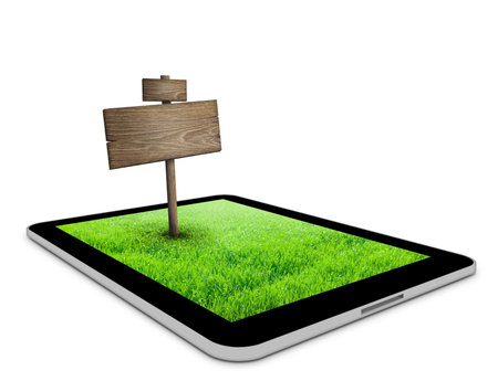 Black tablet with field and road sign on it.Business concept backgroundの写真素材