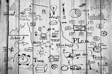 Grey wood blank with business sketches の写真素材