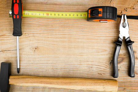 Close up tools on a wooden backgroundの写真素材