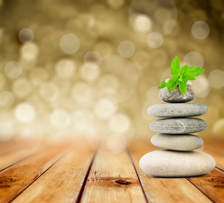 zen stones on the old wooden backgroundの写真素材