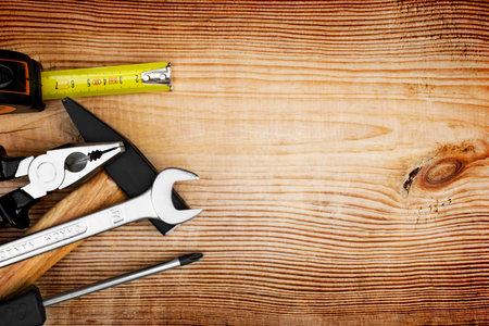 Close up tools on a wooden backgroundの写真素材