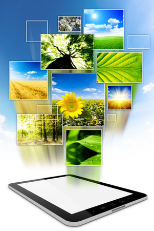 one computer tablet with photo collage of nature, isolated on white backgroundの写真素材