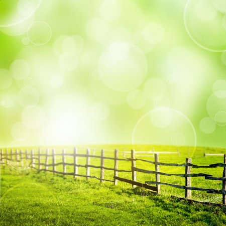 Fence in the grrn field under bokeh sky  Beautiful landscapeの写真素材