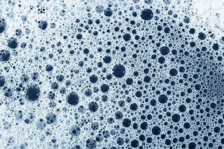 Soap foam and bubbles backgroundの写真素材