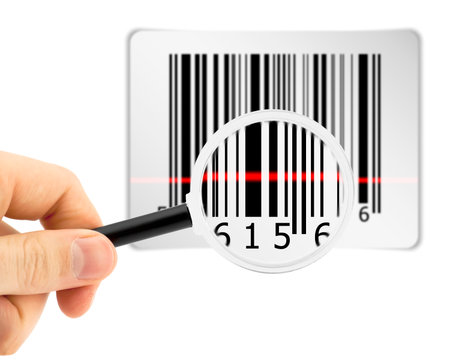 Barcode with scanner laser by magnifier glass in handの写真素材