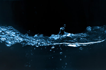 Water and air bubbles over black backgroundの写真素材