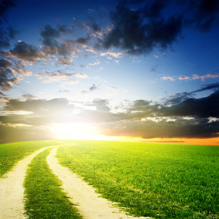 Green field under sunset sky  Beauty nature backgroundの写真素材