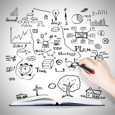 Book with drawing business sketches backgroundの写真素材