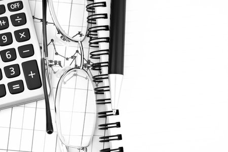 Business concept with notebook and calculator and penの写真素材