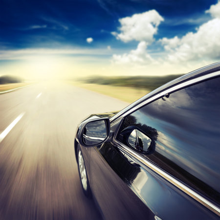 Blurred road and car, speed motion backgroundの写真素材
