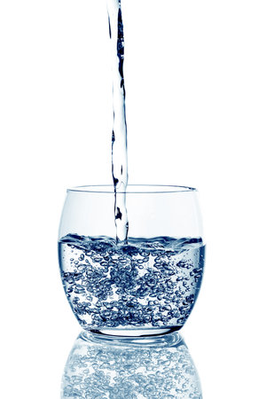 glass with water over white backgroundの写真素材