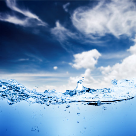 Water and air bubbles over sky backgroundの写真素材