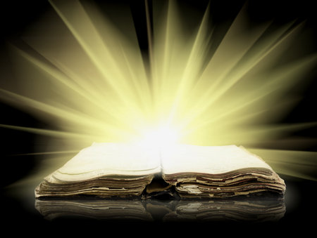 Old bible book with Ray of lightの写真素材