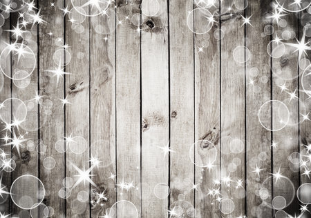 the brown wood texture with white snow and stars. Christmas backgroundの写真素材