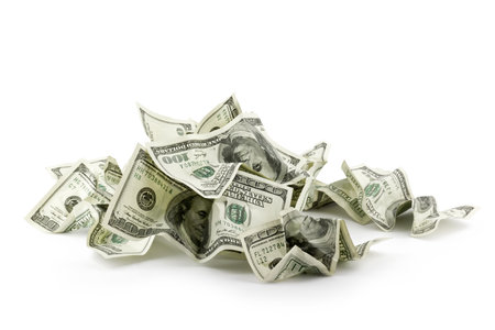 Pile of crumpled money dollar bills overs white backgroundの写真素材