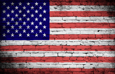 Grunge USA flag on brick wall backgroundの写真素材