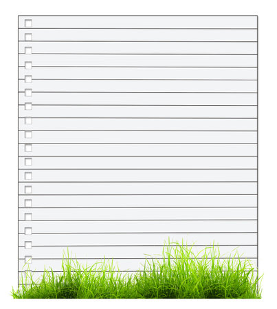 One sheet from notebook with green grass isolated on white backgroundの写真素材