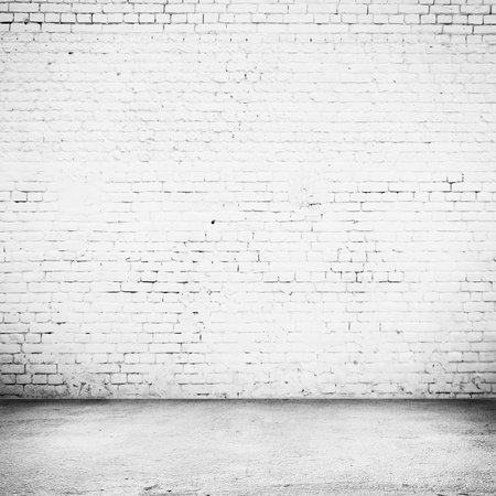 Bright room with tile floor and brick white wall backgroundの写真素材