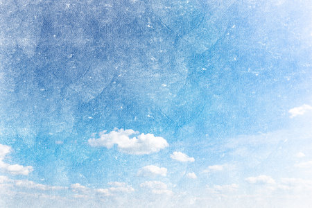 grunge image of a sky with sun and clouds backgroundの写真素材