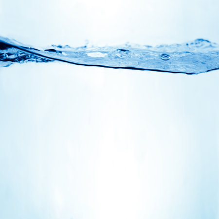 Water and air bubbles over white background with place for textの写真素材