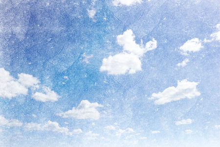 grunge image of a sky with sun and clouds backgroundの写真素材