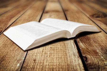 Open Book on wood backgroundの写真素材