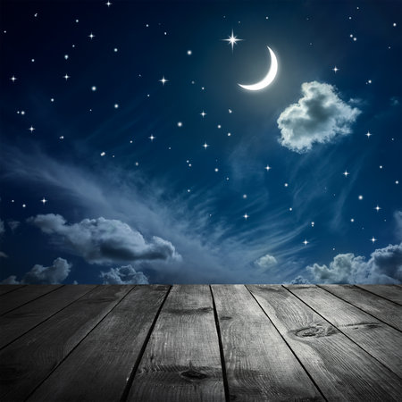Night sky with stars and moon, wooden planksの写真素材