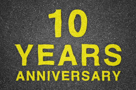 10 years anniversary over asphalt texture backgroundの写真素材