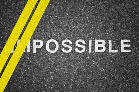 Word impossible over asphalt texture background