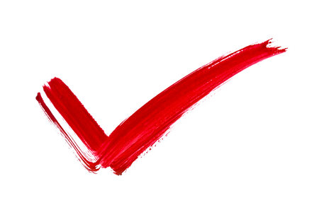 Red mark tick painted by brush on white background