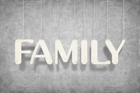 Wooden word "Family" with ropes over white wall backgroundの写真素材