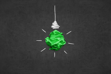 Imitation of lightbulb with cracked paper inside. Inspiration concept backgroundの写真素材