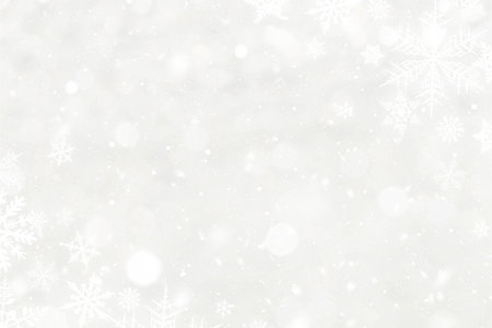 White snowflakes and blured bokeh christmas backgroundの写真素材