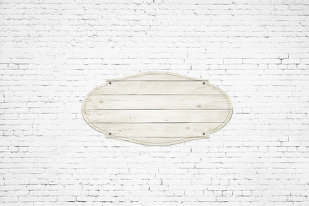 Wooden sign over light concrete wall backgroundの写真素材