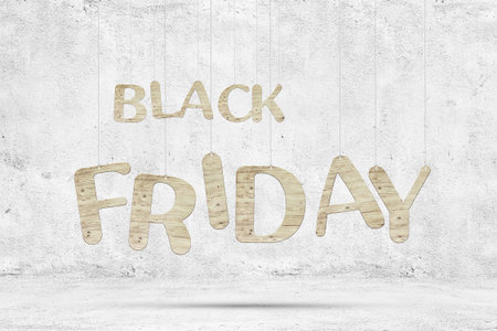 Wooden words "Black Friday" with ropes over white concrete background.の写真素材