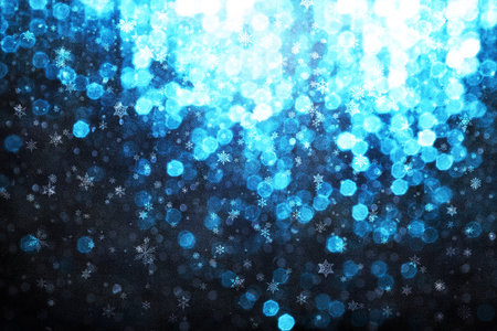 Abstract blue bokeh with snow flakes backgroundの写真素材