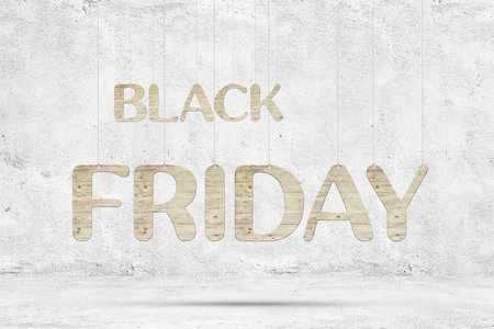 Wooden words "Black Friday" with ropes over white concrete background.の写真素材
