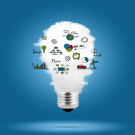 Light bulb with cloud inside and business sketches over blue backgroundの写真素材