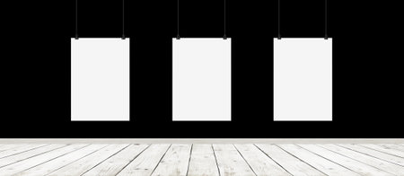 Tree white blank posters with binders in interior with concrete wall and wooden floorの写真素材