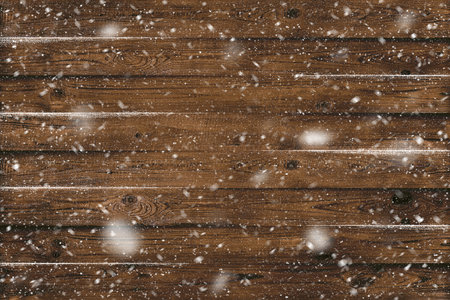 Grunge wood planks with snow flakes falling on. Christmas backgroundの写真素材