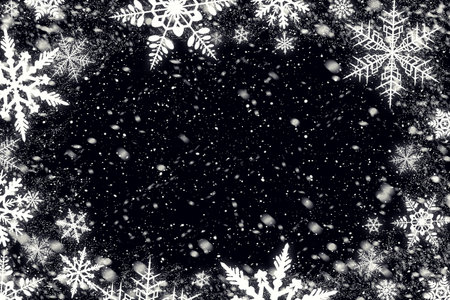 Snow flakes over black background for your photo. Just switch screen blending mode.の写真素材