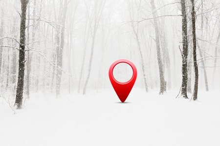 Road in winter snow covered forest with 3d red location pinの写真素材