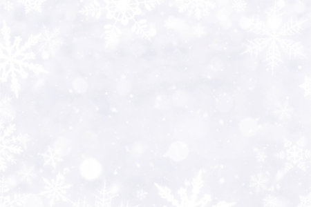 White snowflakes and blured bokeh christmas backgroundの写真素材