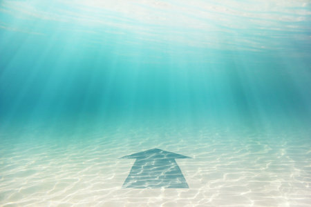 Sea bottom with blue arrow. Abstract conceptual imageの写真素材