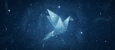 Stars in origami bird shape over blue night sky backgroundの写真素材