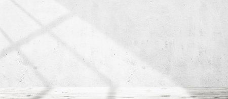 Wooden floor over concrete wall with sunlight from window backgroundの写真素材